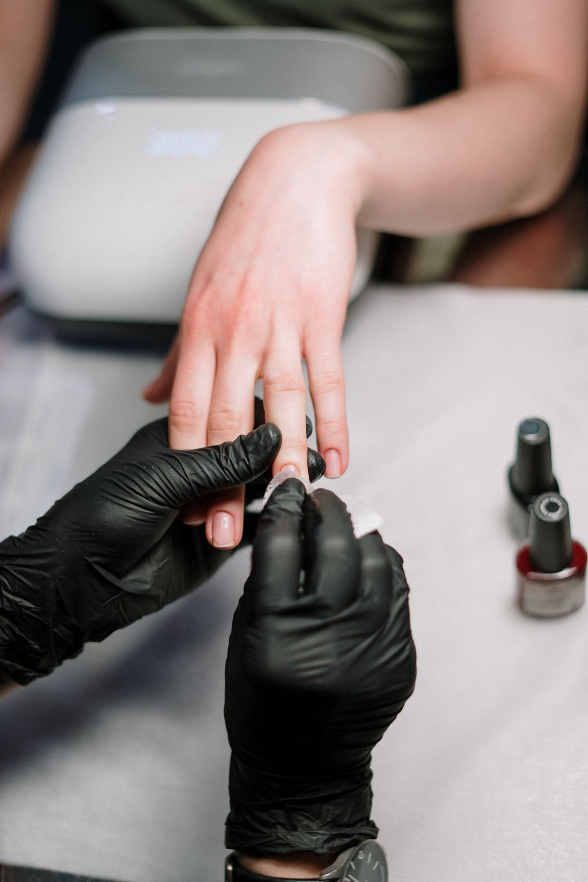 Manicure appointment in progress at a nail salon